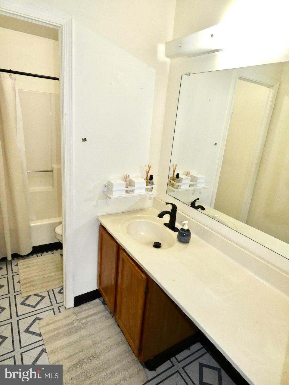 5 Acapella Court Newark, DE 19713 - Photo 23 of 68 a bathroom with a sink and a mirror