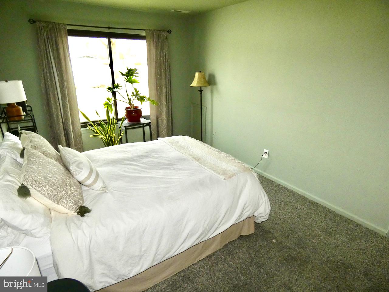 5 Acapella Court Newark, DE 19713 - Photo 29 of 68 a bed sitting in a bedroom next to a window