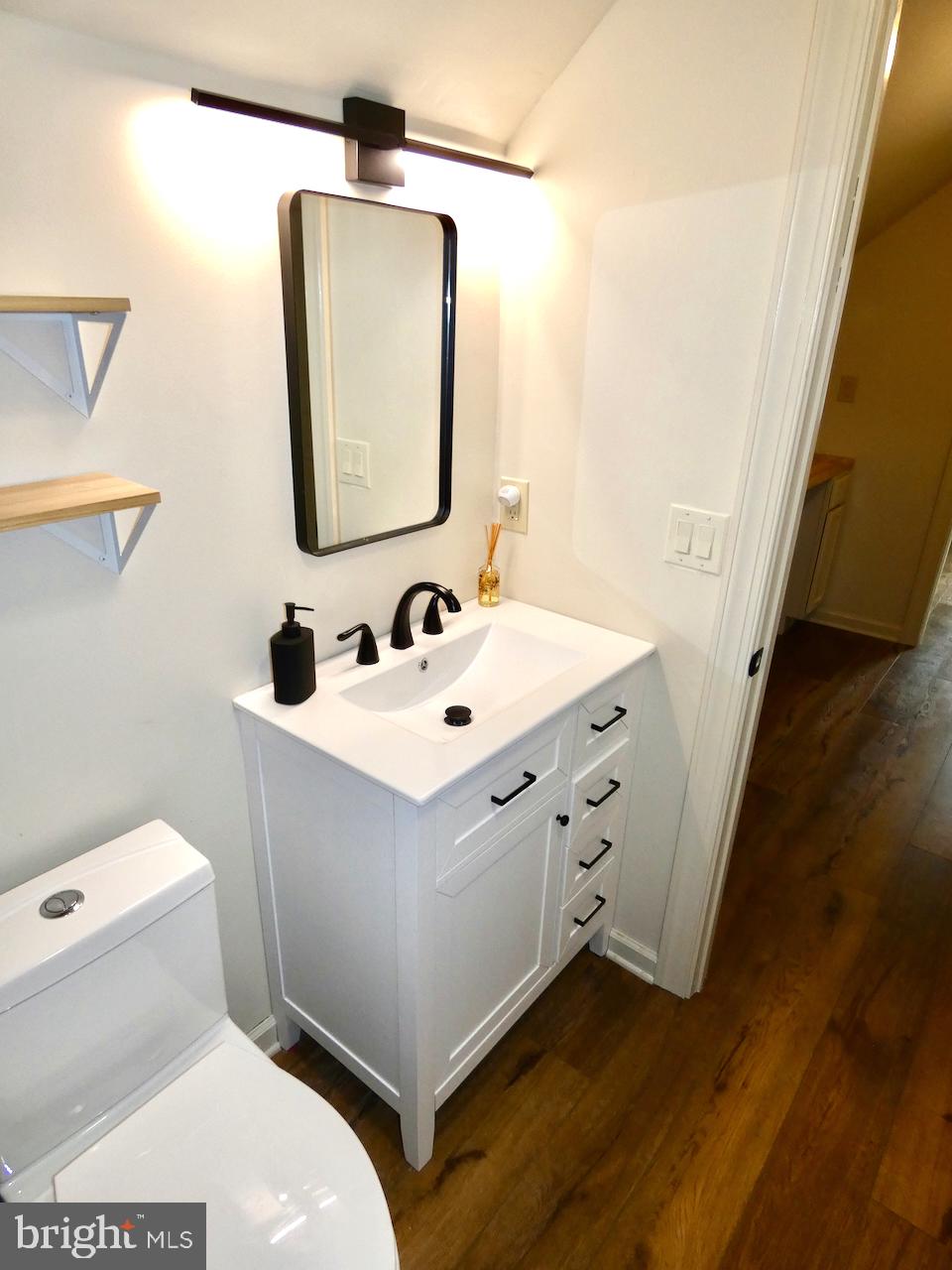 5 Acapella Court Newark, DE 19713 - Photo 47 of 68 a bathroom with a toilet sink and mirror