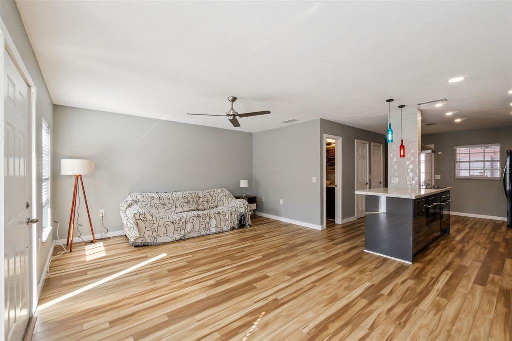 2613 East Church Street Orlando, FL 32803 - Photo 5 of 32 a bedroom with a bed and a view of kitchen