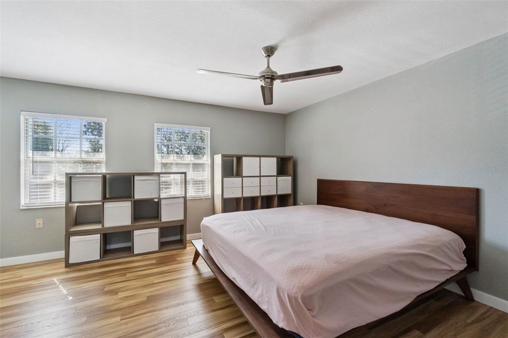 2613 East Church Street Orlando, FL 32803 - Photo 10 of 32 a bedroom with a large bed and window