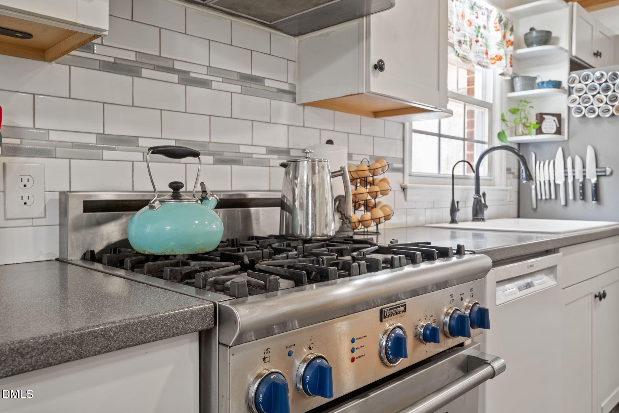 4313 Mitchell Mill Road Wake Forest, NC 27587 - Photo 10 of 45 a kitchen with a stove and a sink