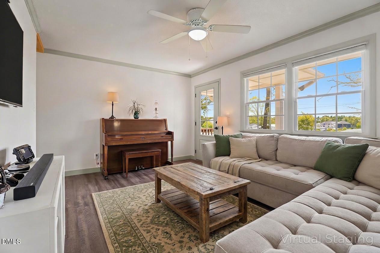 4313 Mitchell Mill Road Wake Forest, NC 27587 - Photo 15 of 45 a living room with furniture a piano and a flat screen tv