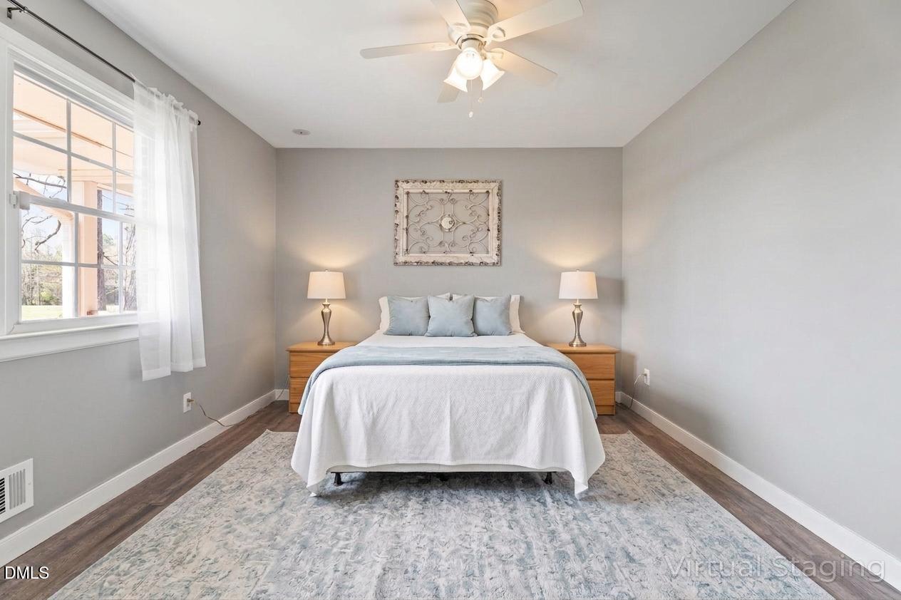 4313 Mitchell Mill Road Wake Forest, NC 27587 - Photo 18 of 45 a bedroom with a bed and window