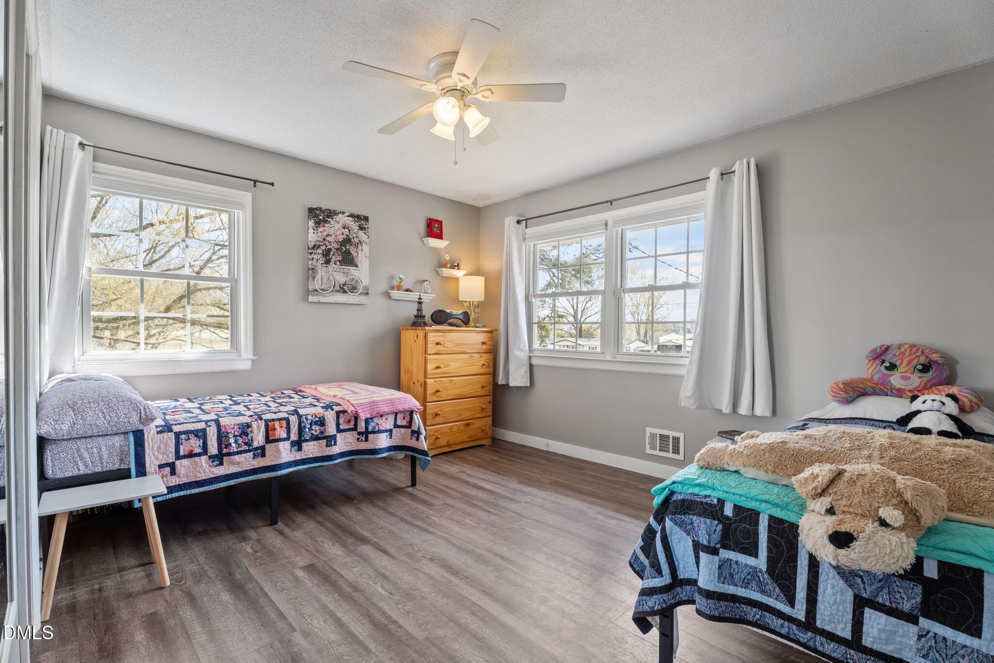 4313 Mitchell Mill Road Wake Forest, NC 27587 - Photo 22 of 45 a bedroom with a bed and wooden floor