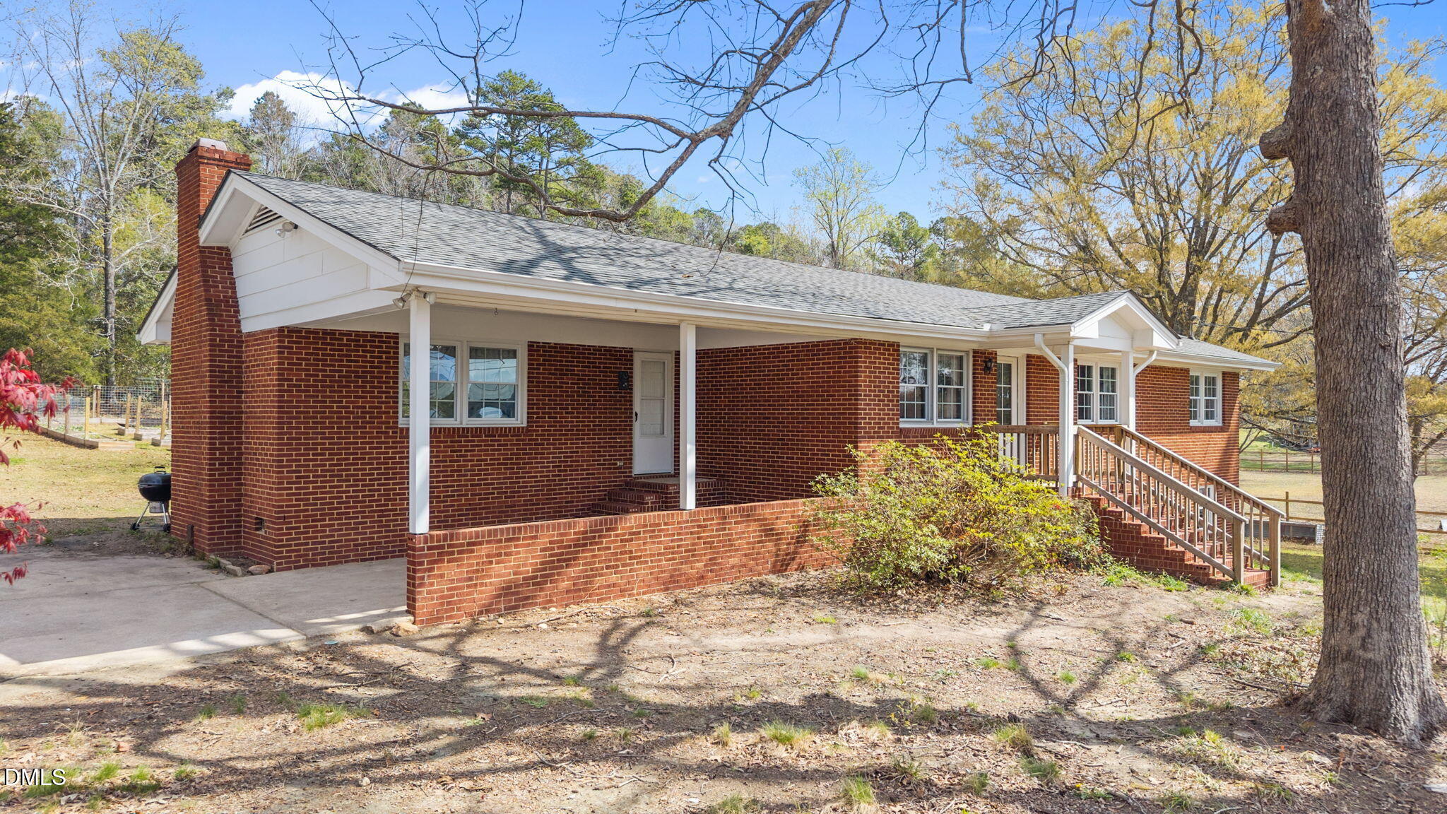 4313 Mitchell Mill Road Wake Forest, NC 27587 - Photo 2 of 45 a front view of a house with a yard and garage