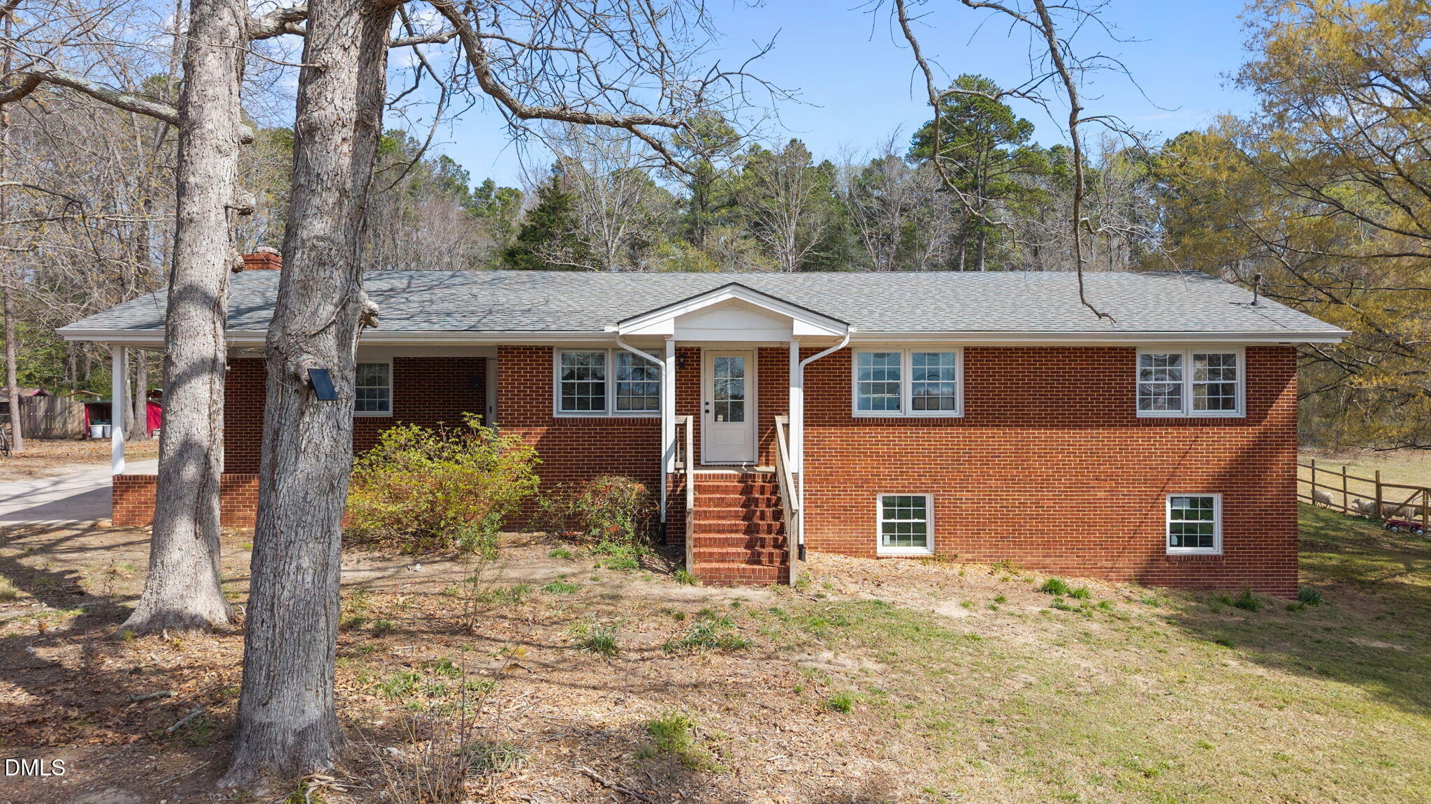 4313 Mitchell Mill Road Wake Forest, NC 27587 - Photo 3 of 45 a front view of a house with a yard and garage