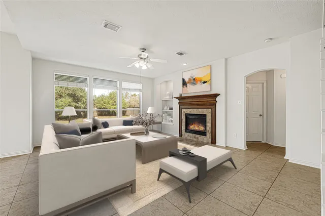 a view of staircase with kitchen island dining table and chairs