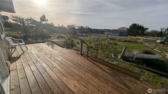 a view of a balcony with wooden floor