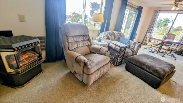 a living room with furniture and a window
