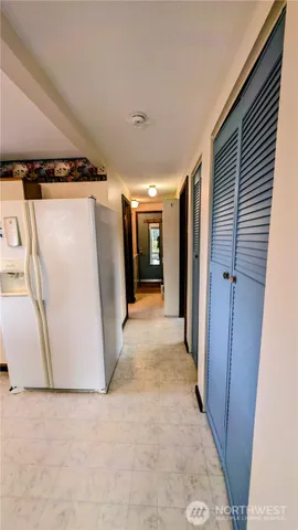 a view of a hallway with stairs
