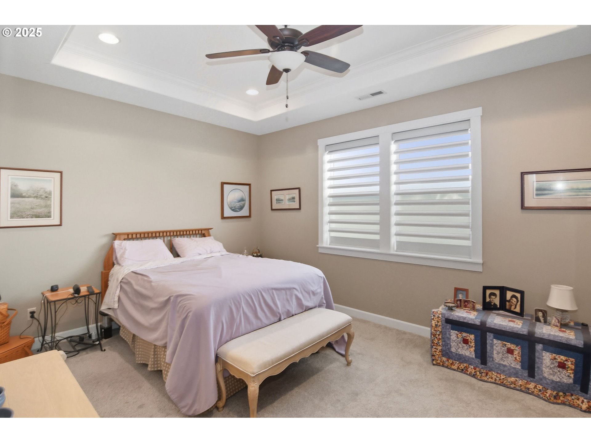 1618 Northeast 174th Street Ridgefield, WA 98642 - Photo 18 of 46 a bedroom with a bed a chandelier and a book shelf