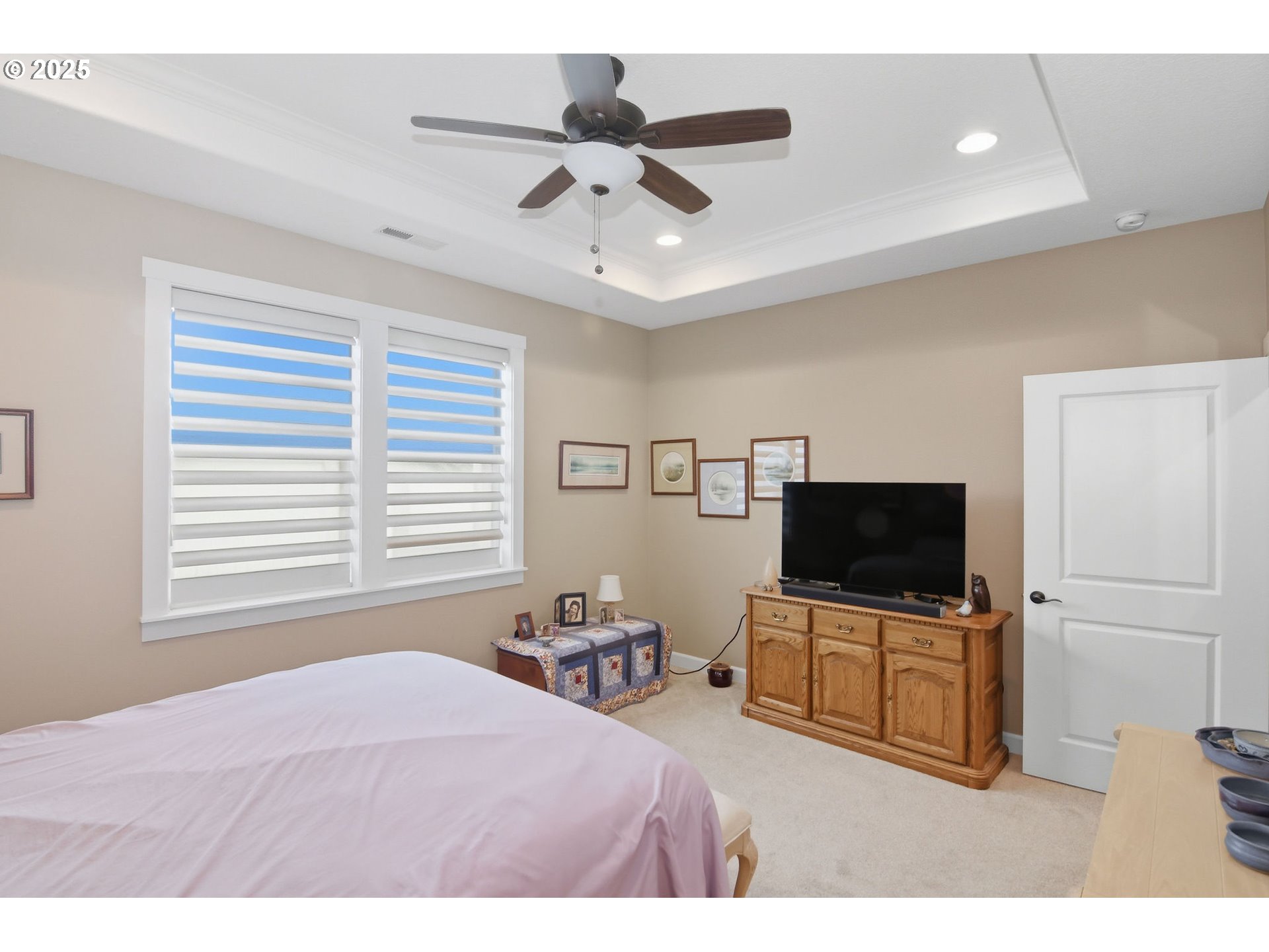 1618 Northeast 174th Street Ridgefield, WA 98642 - Photo 20 of 46 a bedroom with a bed and a flat screen tv