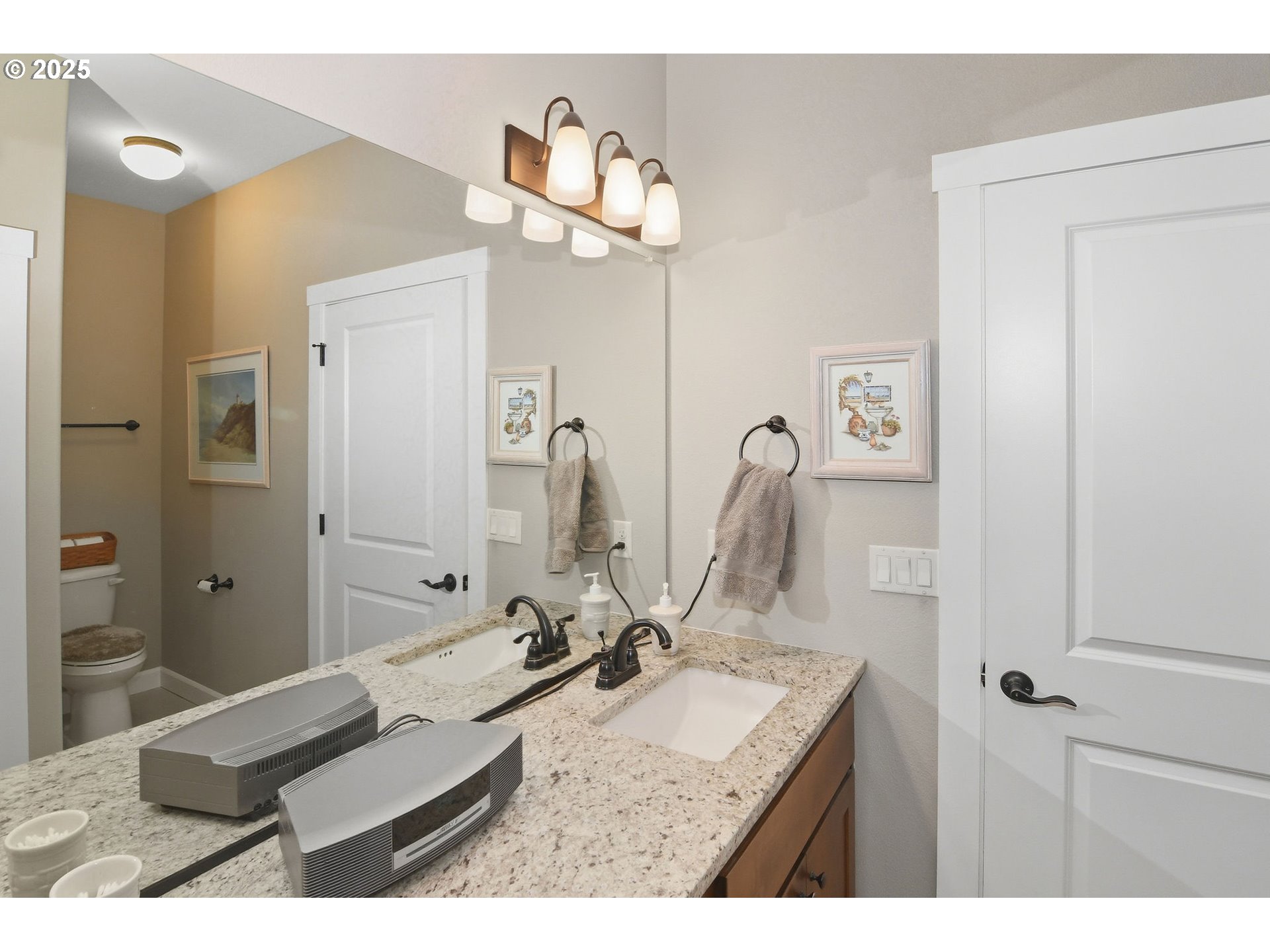 1618 Northeast 174th Street Ridgefield, WA 98642 - Photo 25 of 46 a bathroom with a sink vanity granite and a mirror