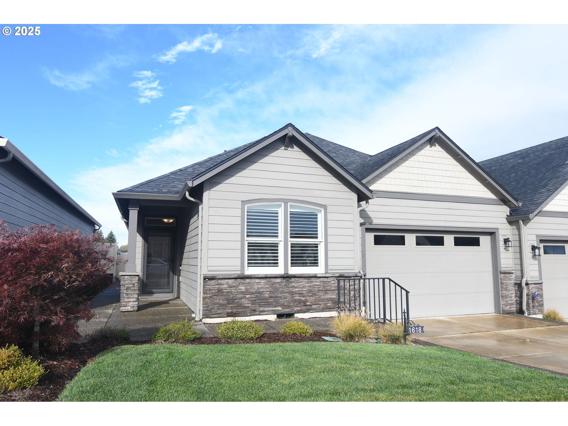 1618 Northeast 174th Street Ridgefield, WA 98642 - Photo 3 of 46 a front view of a house with a yard