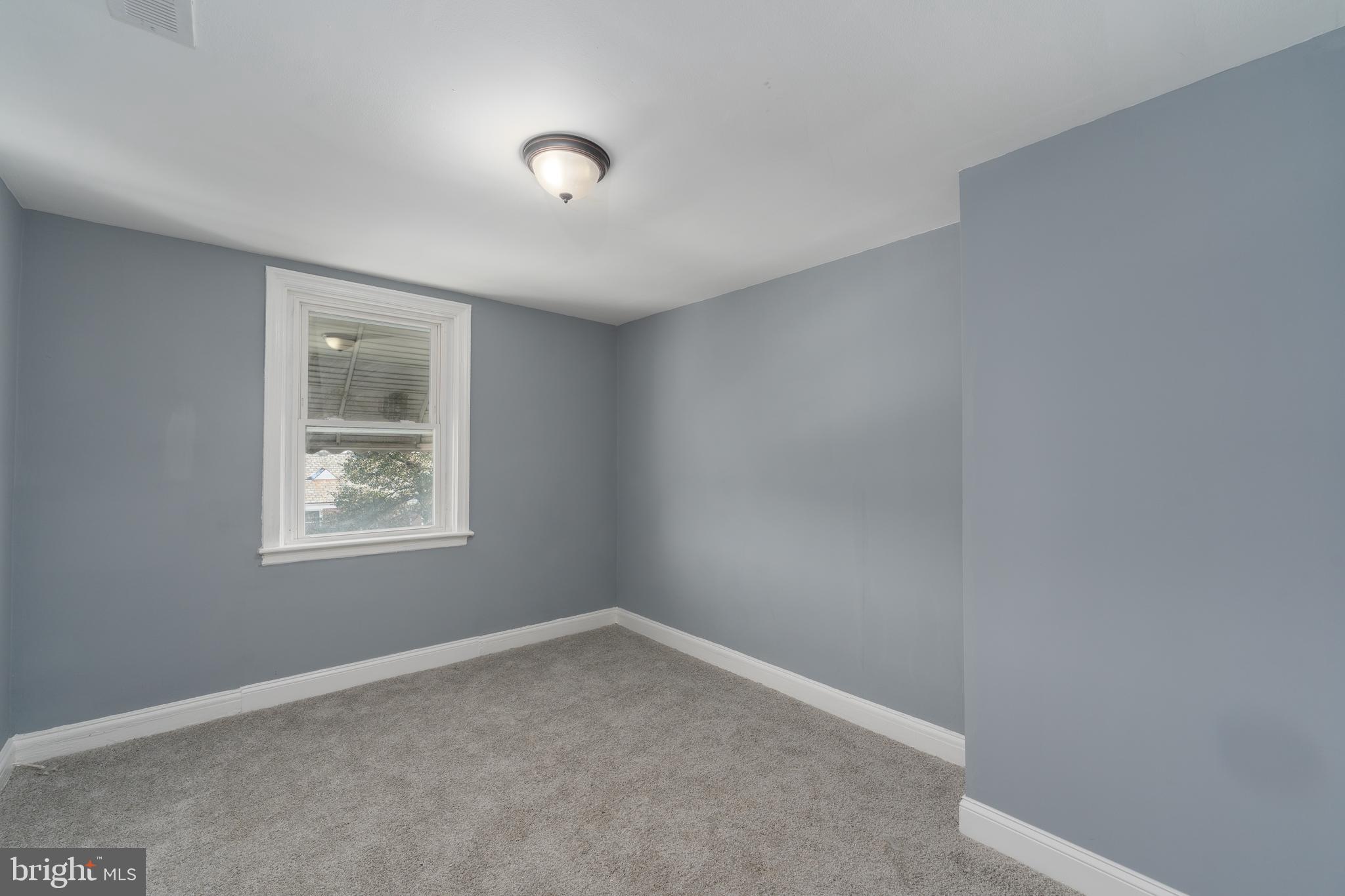 3929 Yolando Road Baltimore, MD 21218 - Photo 11 of 21 an empty room with a window