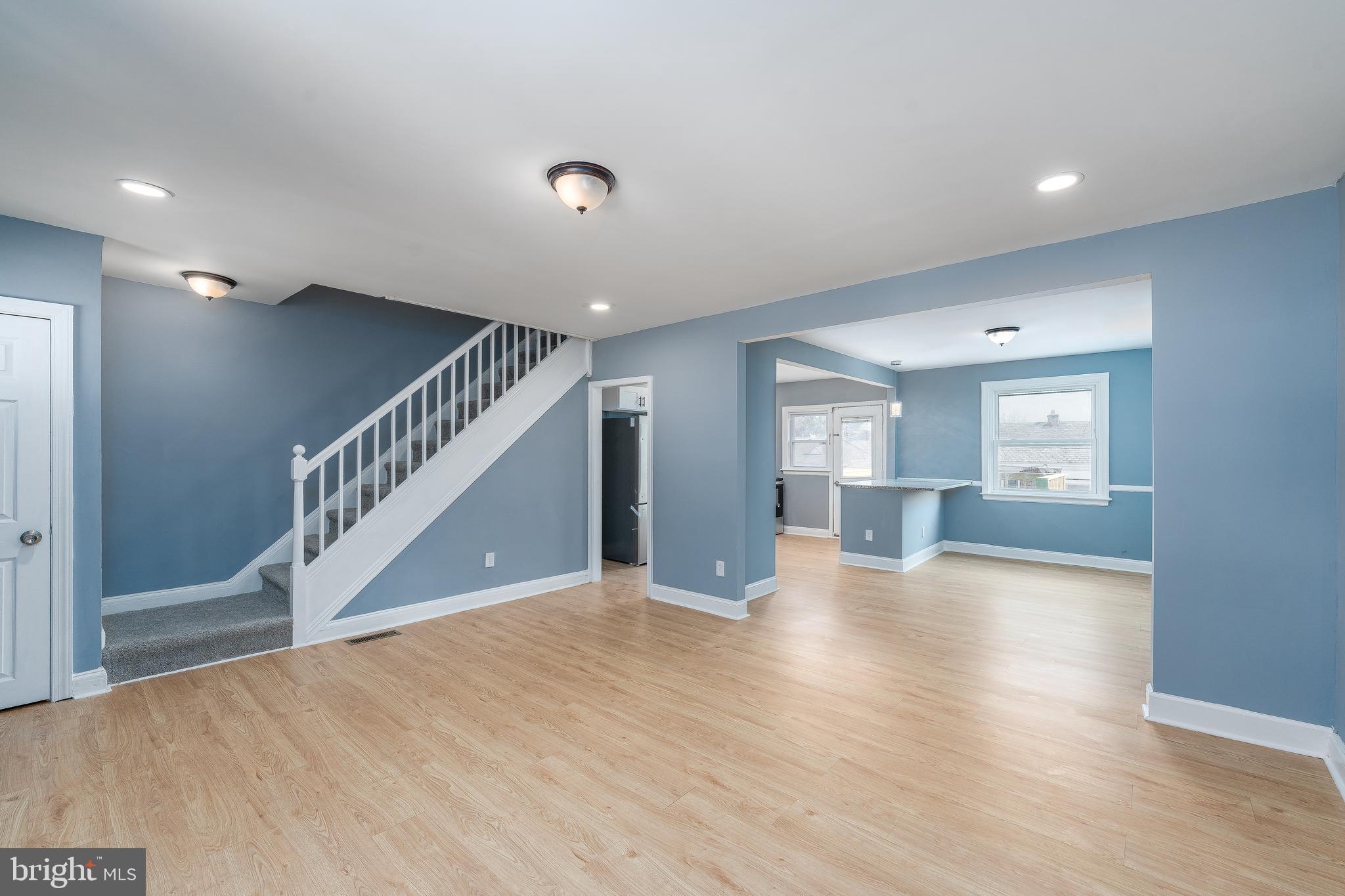 3929 Yolando Road Baltimore, MD 21218 - Photo 21 of 21 a view of a hallway with wooden floor and staircase