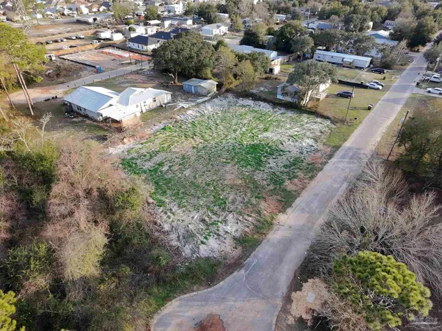 a view of a street with a yard