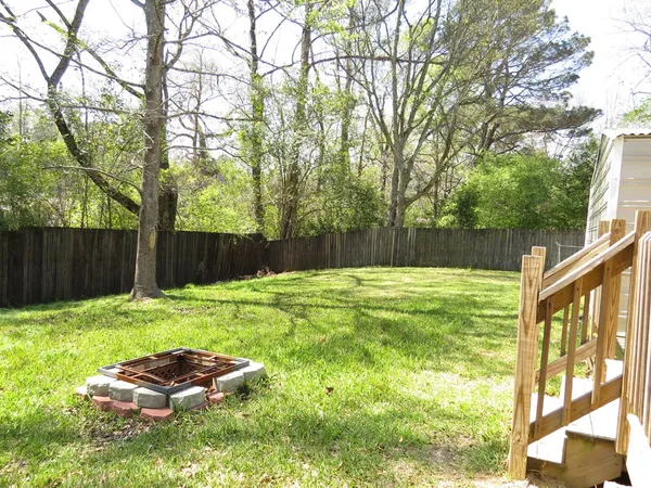 a backyard of a house with lots of green space
