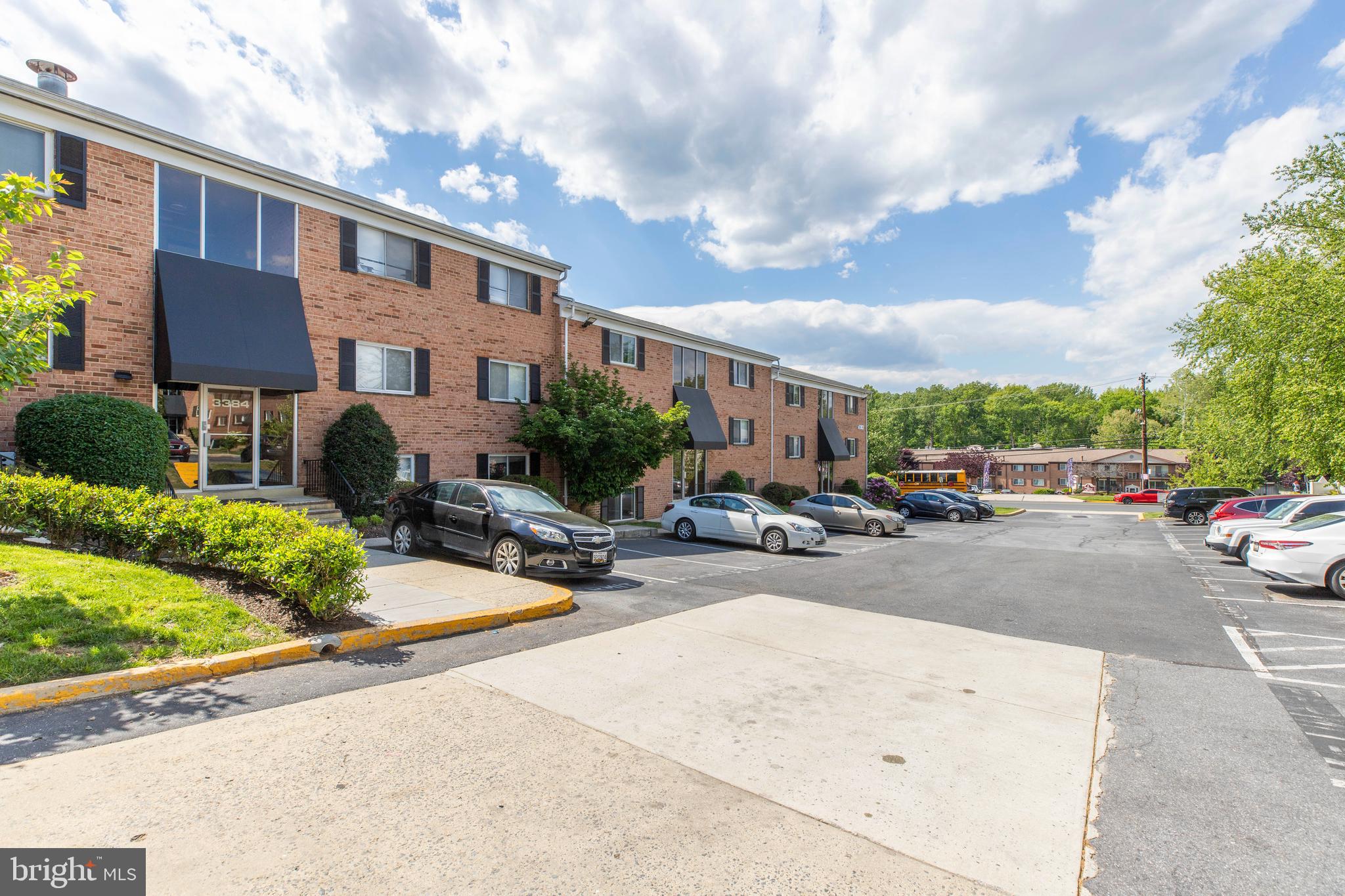 3382 Hewitt Avenue, Unit 102 Silver Spring, MD 20906 - Photo 2 of 22 a row of cars parked in front of a building