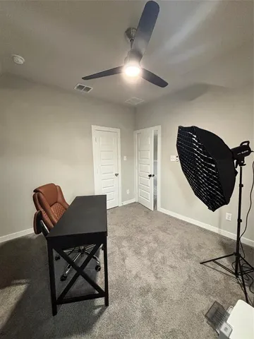 a view of a livingroom with furniture and a potted plant