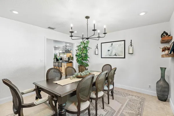 a kitchen with stainless steel appliances granite countertop a stove and a refrigerator