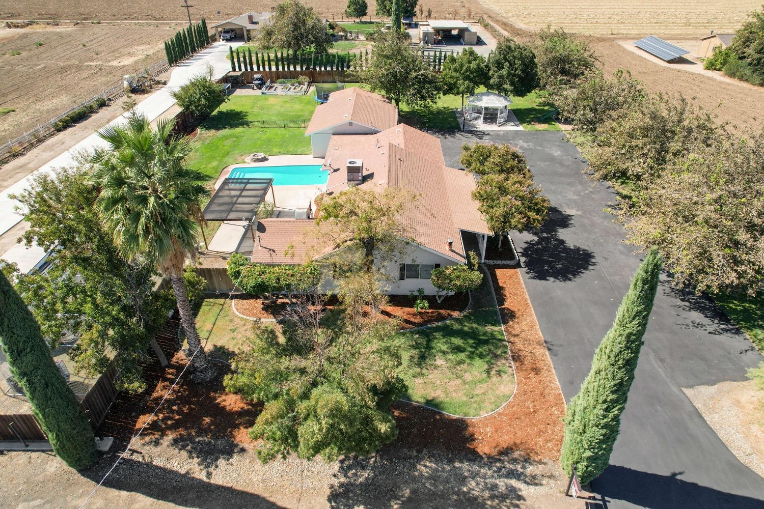 30467 South Koster Road Tracy, CA 95304 - Photo 1 of 1 an aerial view of a house with a yard and lake view