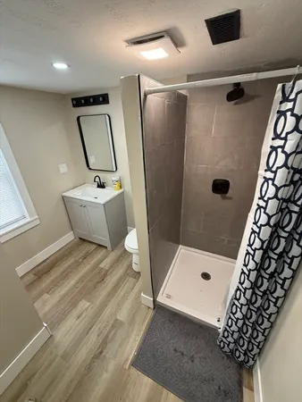 a bathroom with a bathtub and shower