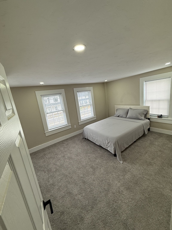 44 South Street Ware, MA 01082 - Photo 21 of 42 a spacious bedroom with a bed and a window