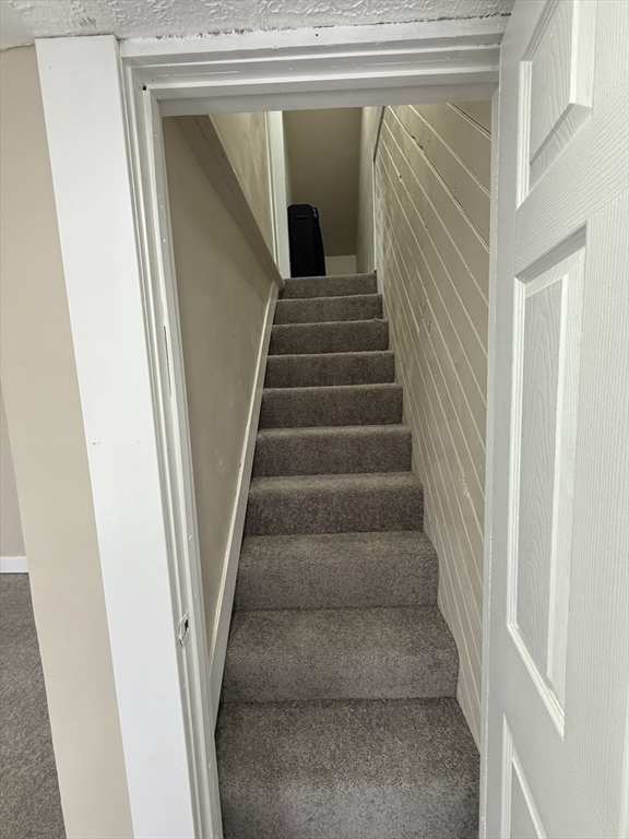 44 South Street Ware, MA 01082 - Photo 22 of 42 a view of staircase with white walls and a window