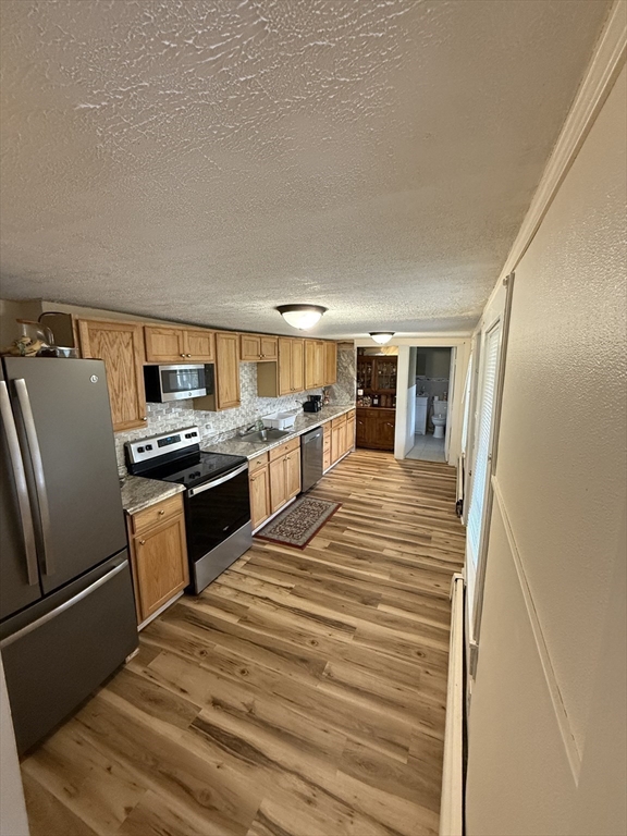 44 South Street Ware, MA 01082 - Photo 32 of 42 a kitchen with stainless steel appliances granite countertop a refrigerator and a stove top oven