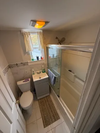 a bedroom with two beds and painted walls