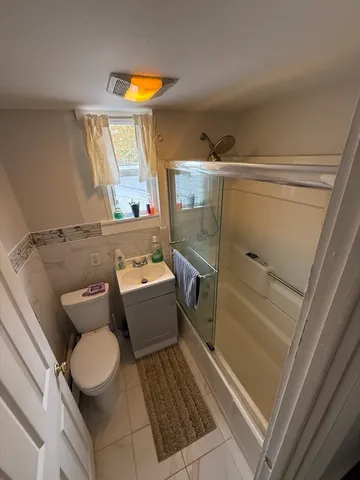 a bedroom with two beds and painted walls