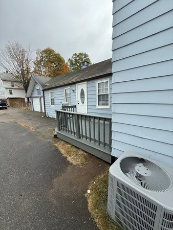 a view of backyard with a deck and furniture