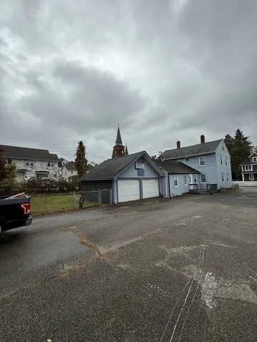 a view of a car parked in front of a house