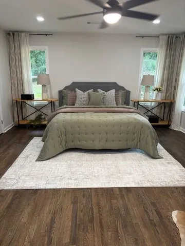 a bedroom with a bed and window