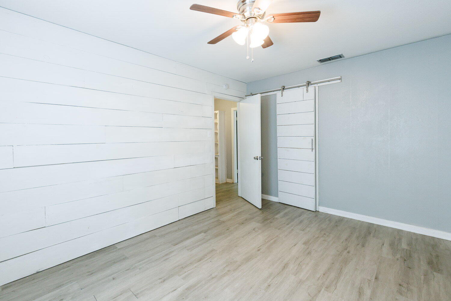3605 26th Street Lubbock, TX 79410 - Photo 17 of 21 wooden floor in an empty room