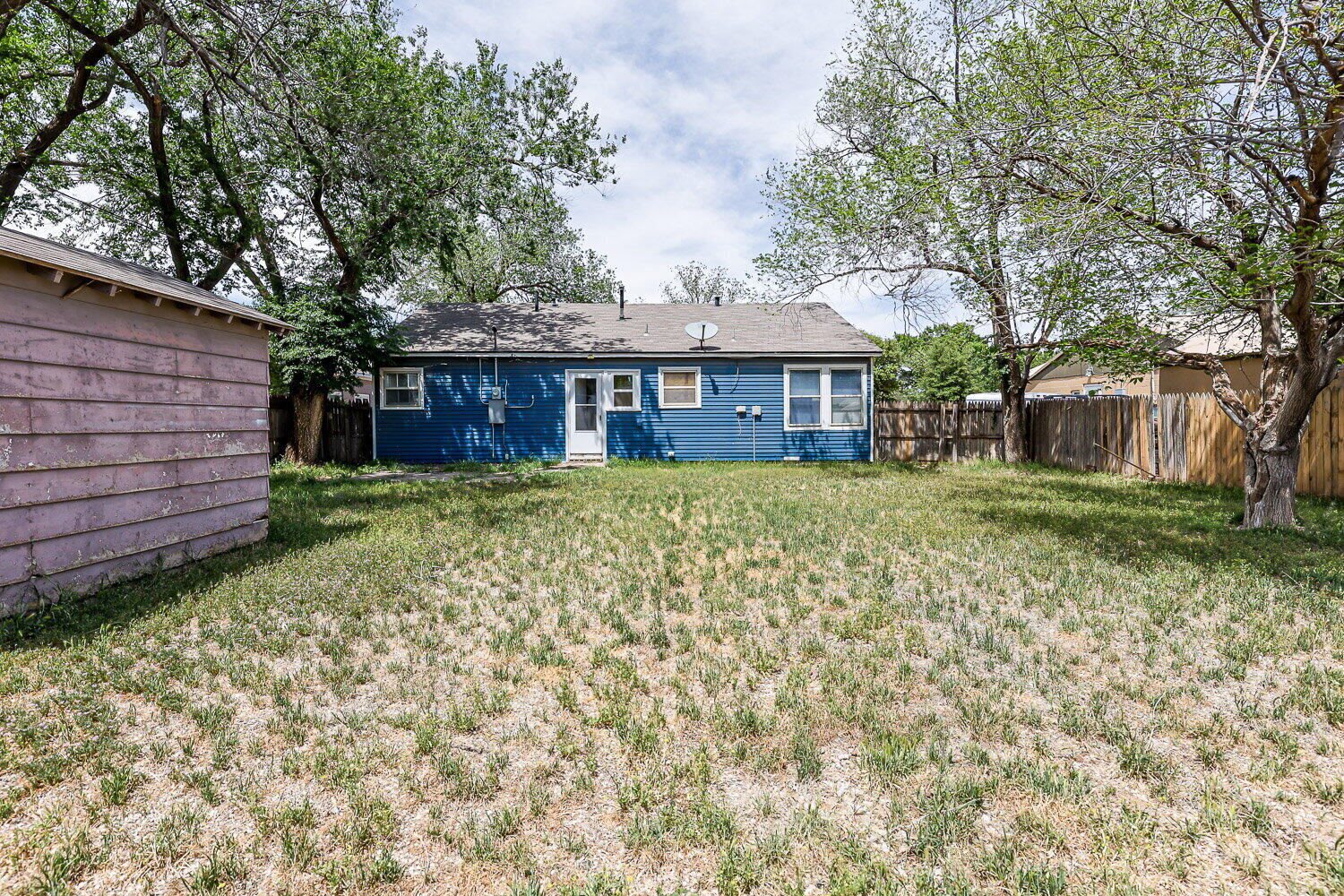 3605 26th Street Lubbock, TX 79410 - Photo 20 of 21 front view of a house with a yard
