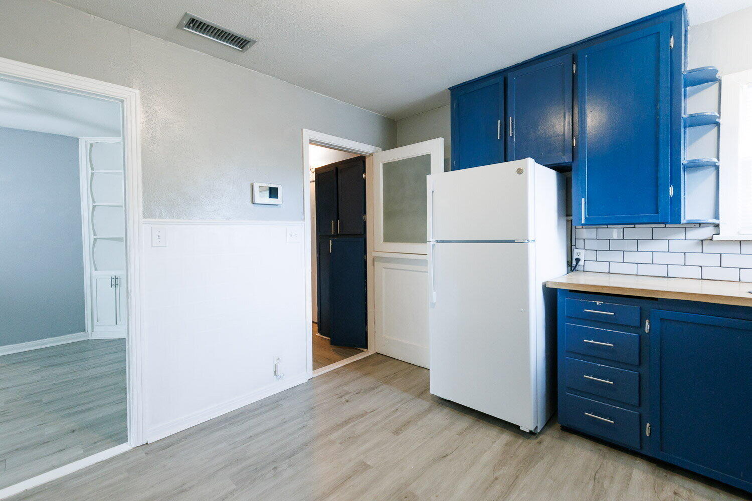 3605 26th Street Lubbock, TX 79410 - Photo 5 of 21 a white refrigerator freezer sitting in a kitchen