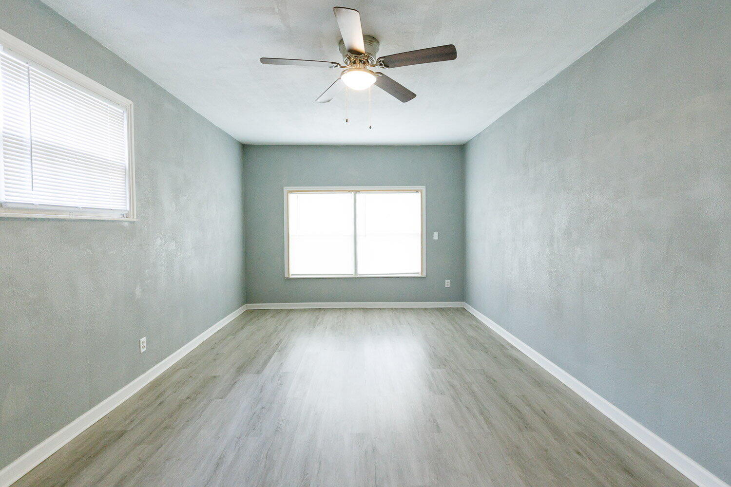 3605 26th Street Lubbock, TX 79410 - Photo 9 of 21 wooden floor in an empty room with a window
