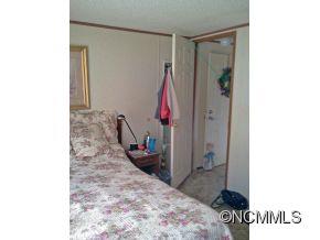 1027 Deep Gap Loop Road Flat Rock, NC 28731 - Photo 14 of 16 a view of a bedroom