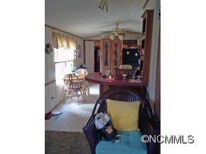 1027 Deep Gap Loop Road Flat Rock, NC 28731 - Photo 7 of 16 a room with workspace and mirror