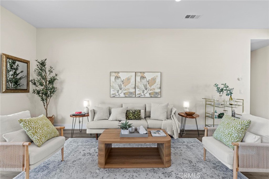6148 Ripley Lane Paradise, CA 95969 - Photo 11 of 37 a living room with furniture and a potted plant
