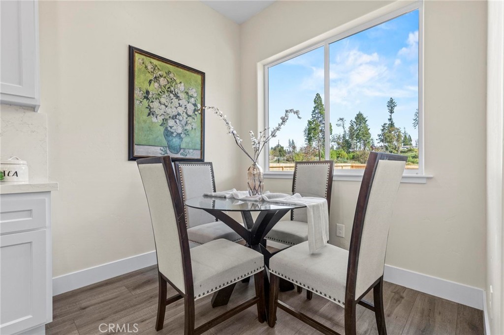 6148 Ripley Lane Paradise, CA 95969 - Photo 16 of 37 a view of a dining room with furniture window and wooden floor
