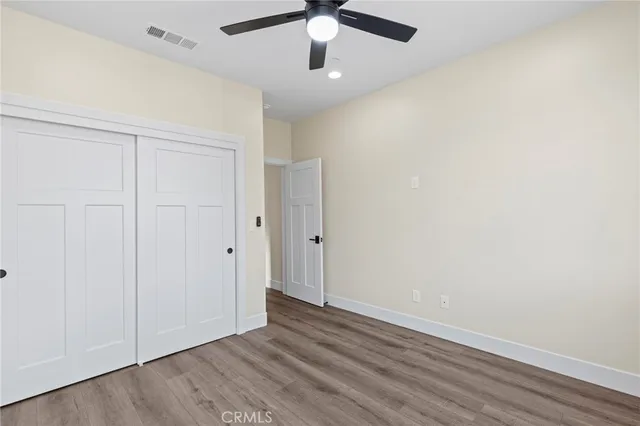 a view of kitchen with refrigerator and window