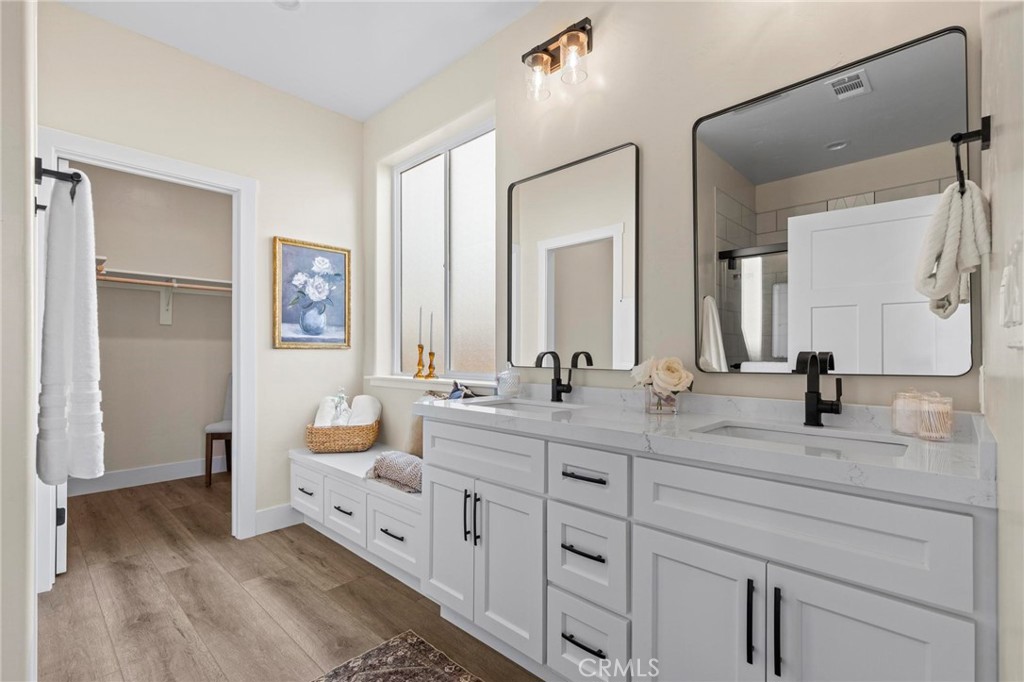 6148 Ripley Lane Paradise, CA 95969 - Photo 27 of 37 a bathroom with double vanity sinks and a mirror