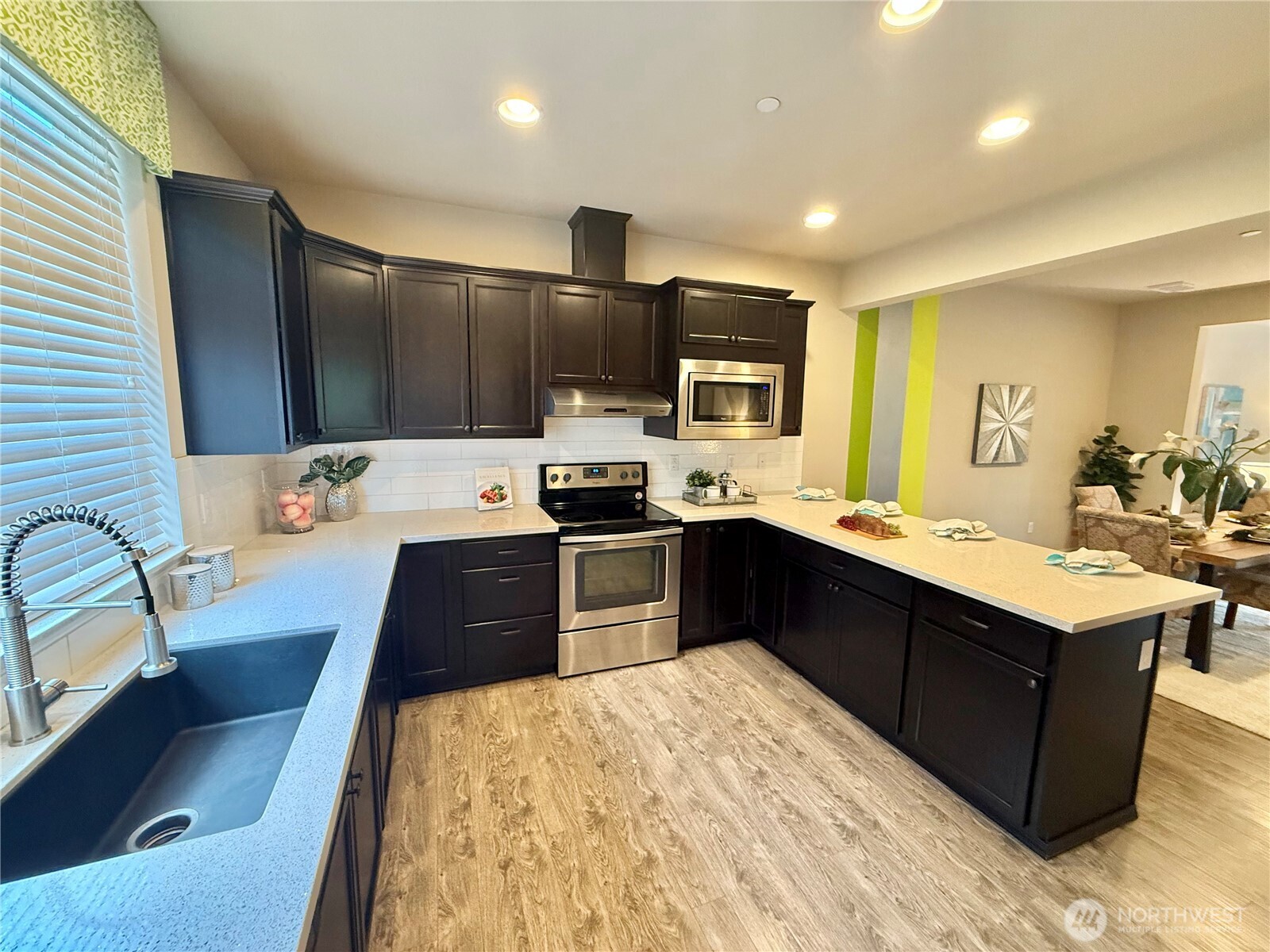 1928 78th Place Southeast Everett, WA 98203 - Photo 12 of 39 a large kitchen with stainless steel appliances a sink counter space and a window