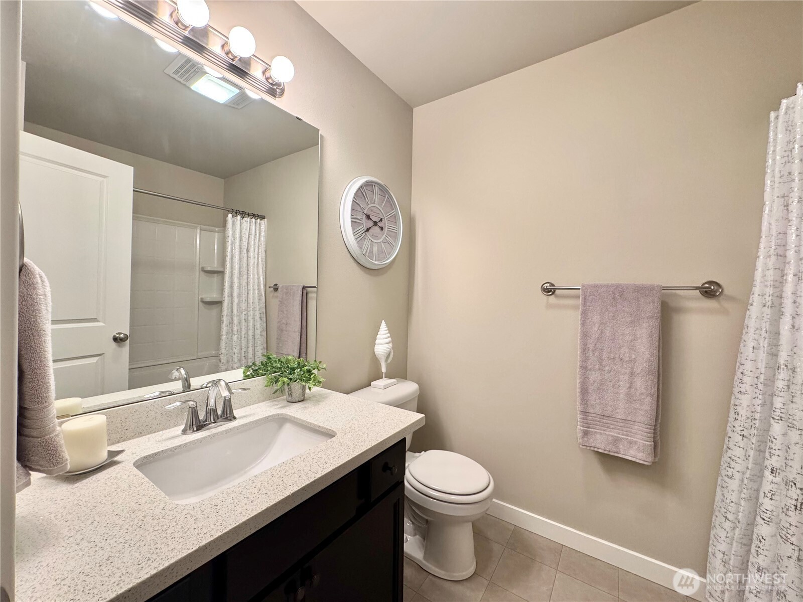 1928 78th Place Southeast Everett, WA 98203 - Photo 24 of 39 a bathroom with a granite countertop sink a toilet and a mirror