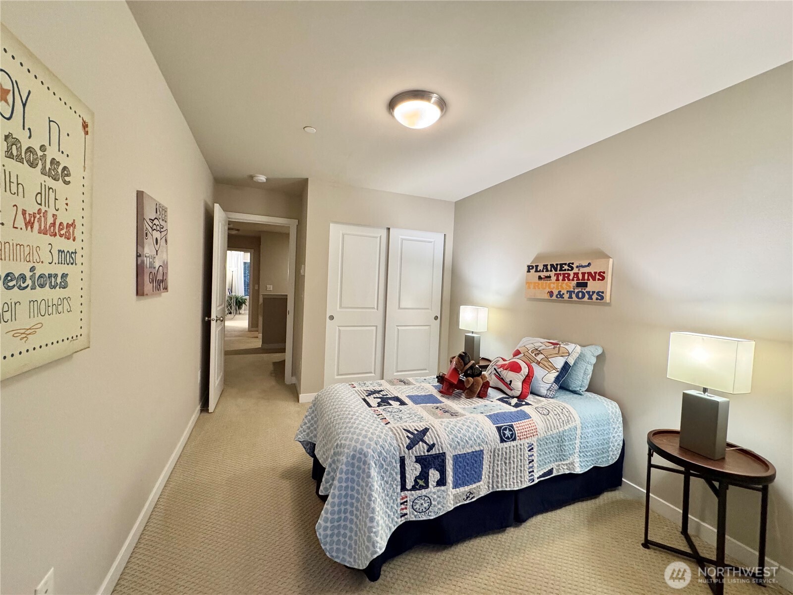 1928 78th Place Southeast Everett, WA 98203 - Photo 26 of 39 a bedroom with a bed and a lamp on table