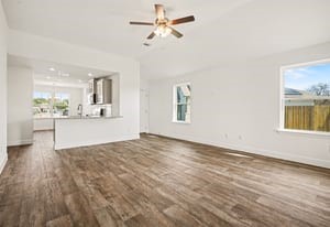 29 Greenbriar Loop Angleton, TX 77515 - Photo 18 of 19 Open-concept living room and kitchen, creating a spacious, connected area perfect for entertaining and everyday living.